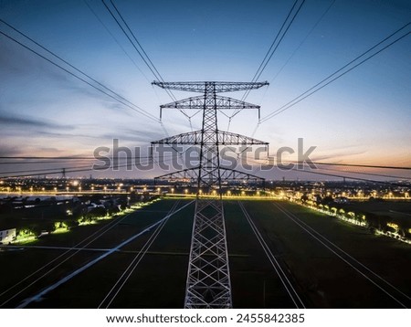 Similar – Image, Stock Photo Silhouette high voltage electric pylon and electrical wire with an orange sky. Electricity poles at sunset. Power and energy concept. High voltage grid tower with wire cable at distribution station.