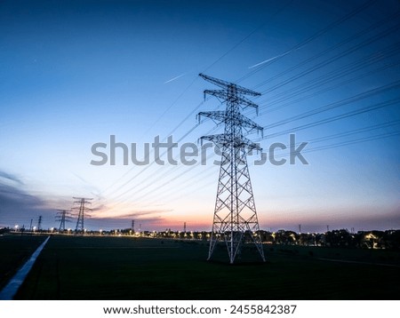 Similar – Image, Stock Photo Silhouette high voltage electric pylon and electrical wire with an orange sky. Electricity poles at sunset. Power and energy concept. High voltage grid tower with wire cable at distribution station.