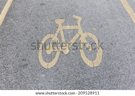 bicycle sign on the cement road