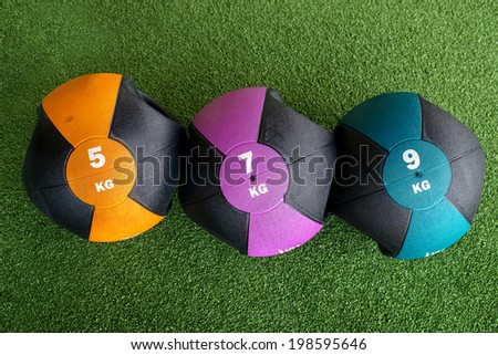 weight ball on green background