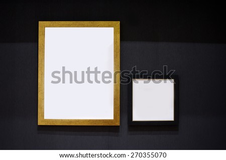 Blank white paper canvas photo  frame on the black wall for a bulletin