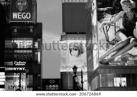 OSAKA,JAPAN- JULY 22: Twilight view of the neon advertisements Dotonbori on Jul 22, 2013 in Osaka, Japan.Is famous for its historic theatres,and restaurants, and its many neon and mechanised signs