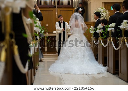 OSAKA, Japan - JULY : a father is blessing the bride in wedding ceremony at July 21, 2013 at local christian church