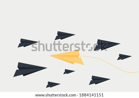 paper planes flying and one flying against the current