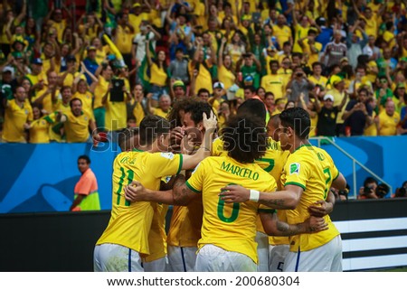 BRASILIA, BRAZIL - June 23, 2014: Brazil team celebrate after scoring a goal during the 2014 World Cup game between Brazil and Cameroon at Estadio Nacional Mane Garrincha. No Use in Brazil.