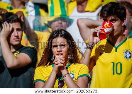 BELO HORIZONTE, BRAZIL - June 28, 2014: Brazil soccer fans hoping for a win at the 2014 World Cup Round of 16 game between Brazil and Chile at Mineirao Stadium. No Use in Brazil.