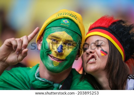 BELO HORIZONTE, BRAZIL - July 8, 2014: Brazil soccer fans celebrating at the 2014 World Cup Semi-finals game between Brazil and Germany at Mineirao Stadium. NO USE IN BRAZIL.