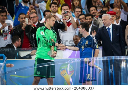 RIO DE JANEIRO, BRAZIL - July 13, 2014: Neuer of Germany wins the Golden Gloves Award for the Best Goalkeeper of the Tournament, while Messi wins the Golden Ball for the Best Player. NO USE IN BRAZIL.
