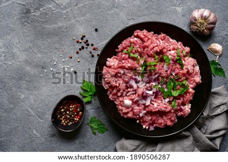 Similar – Image, Stock Photo Bowl of minced meat near eggs and herbs