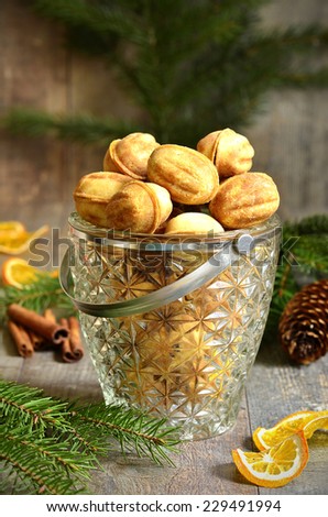 Cookies ''Nuts'' with sweeted condensed milk on festive background.