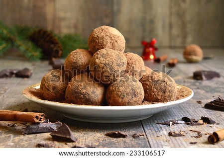 Homemade chocolate truffles on a plate.