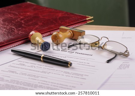pen, key and stamps on mortgage application form