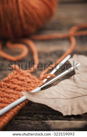 Orange woolen thread with knitted scarf