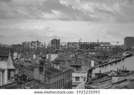 Top view in long focal length on old brick buildings on Rue des Prêtres Street, in Les Carmes, a historic neighborhhod in the city centre of Toulouse, in the South of France (black and white) Photo stock © 