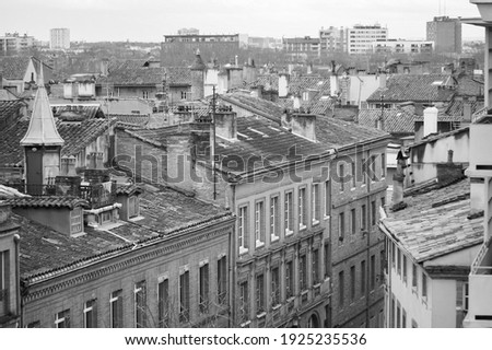 Top view in long focal length on old brick buildings on Rue des Prêtres Street, in Les Carmes, a historic neighborhhod in the city centre of Toulouse, in the South of France (black and white) Photo stock © 