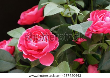 A Artificial Rose of Handicraft. Both The Red Flowers And Leaves Are Made From Artificial Fabrics.