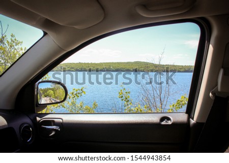 Similar – Image, Stock Photo inside view from the car of a cloudy sunset while driving. winter season