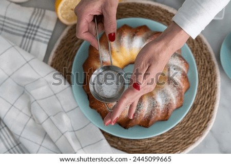 Similar – Image, Stock Photo Person sprinkling icing sugar over on cookies