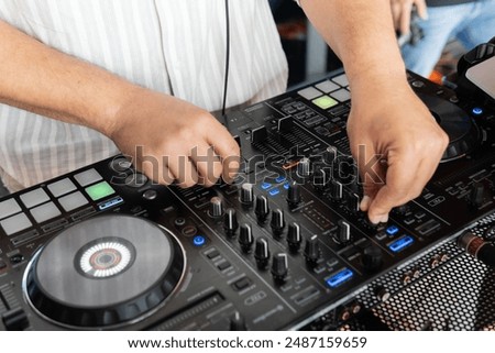 Similar – Image, Stock Photo DJ mixing music during party in club