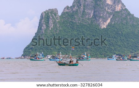PRACHUAP KHIRI KHAN, THAILAND - MAY 24 : Many fishing boats moored on the coast to prepare for fishing on the gulf of Thailand on May 10, 2015 in Prachuap Khiri Khan, Thailand.