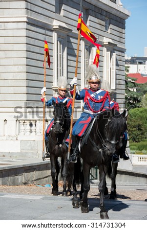 MADRID, SPAIN - OCT 30: Royal Guards participate in the Changing of the Guard at Royal Palace on October 30, 2013 in Madrid, Spain.