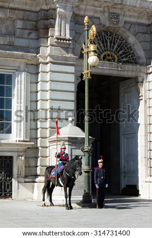 MADRID, SPAIN - OCT 30: Royal Guards participate in the Changing of the Guard at Royal Palace on October 30, 2013 in Madrid, Spain.