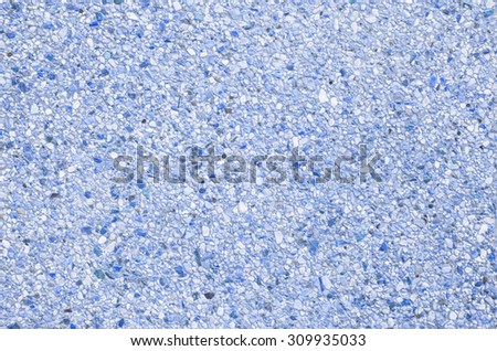 Abstract background of exposed aggregate concrete texture Blue color