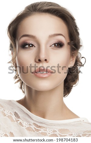 Beautiful young woman with bridal makeup and hairstyle. Classic wedding bridal look