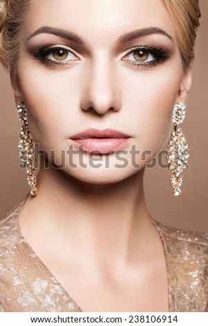 Beautiful woman with evening make-up and perfect skin. Party look