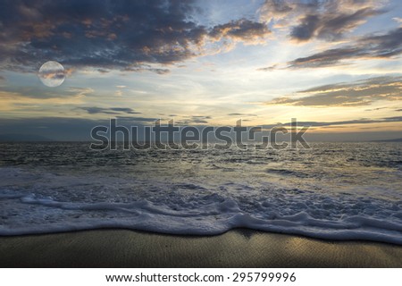Ocean landscape with beach and moon clouds.