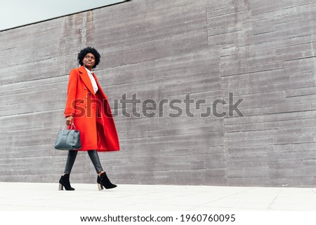 Similar – Image, Stock Photo Focused stylish black woman applying eyeliner at home