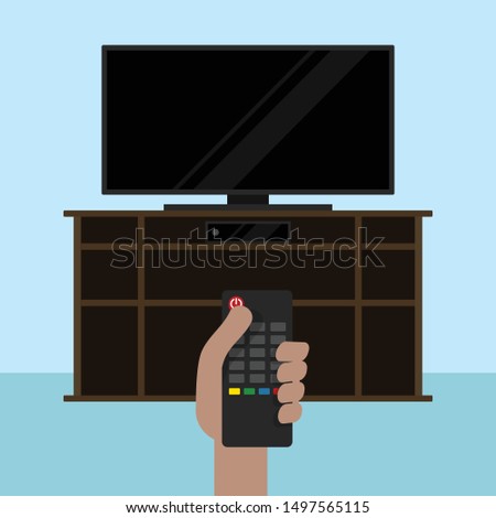 
person with tv off on dresser with tv control in hand