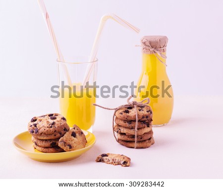 Homemade cookies with chocolate and orange juice. Isolated on a white background.