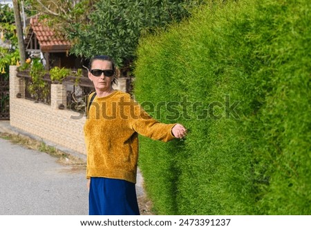 Similar – Image, Stock Photo Woman near green bushes