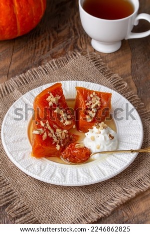 Similar – Image, Stock Photo Chopped pumpkin drizzled with oil for baking