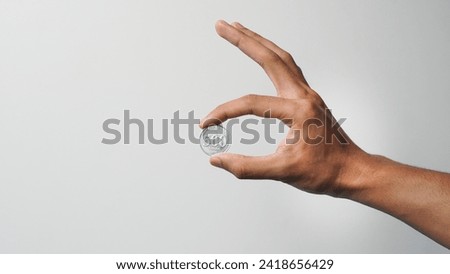 Similar – Image, Stock Photo hand holding 500 coins indonesian rupiah