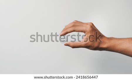 Similar – Image, Stock Photo hand holding 500 coins indonesian rupiah