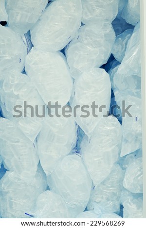 Ice cubes in blue plastic bags