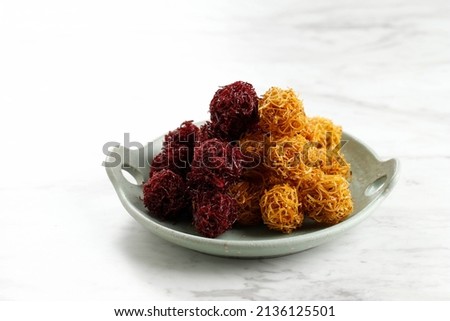 Two Color Grubi, Gurabi, or Kremes Ubi, Traditional Indonesian Snack made from Sweet Potato and Palm Sugar. On White Table, Isolated Zdjęcia stock © 