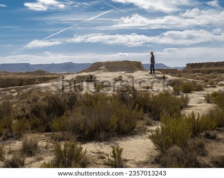 Similar – Image, Stock Photo Male traveler in Bardenas Reales in summer