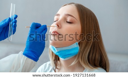 Doctor taking PCR test nasopharyngeal culture to woman patient. Nurse take saliva sample through nose with cotton swab check coronavirus covid 19 test. Diagnostics testing patients. Long web banner