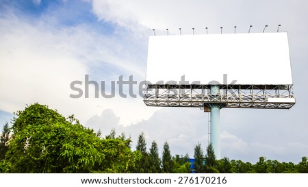 Blank billboard with cloudy and blue sky background.