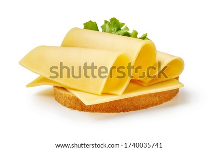 Cheese slices with salad leaf on piece of bread. Sandwich isolated on white background.