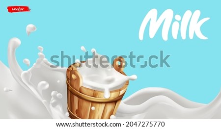 Wooden milk bucket with splash of milk. Natural dairy product. Concept for package of milk.