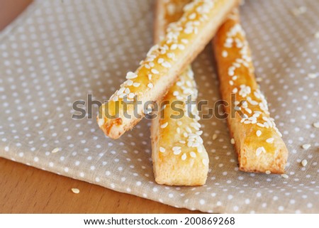 Bread sticks  with cheese and sesame on  the napkin, close up