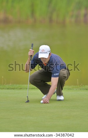 OAKVILLE, ONTARIO - JULY 22: Canadian golfer Mike Weir lines up a putt during a pro-am event at the Canadian Open golf on July 22, 2009 in Oakville, Ontario..
