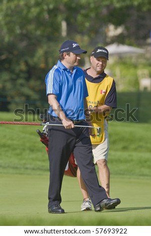 TORONTO, ONTARIO - JULY 21: South African golfer Tim Clark walks off a green during a pro-am event at the RBC Canadian Open golf on July 21, 2010 in Toronto, Ontario.