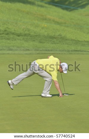 TORONTO, ONTARIO - JULY 21:English golfer Paul Casey picks up his ball after putting during a pro-am event at the RBC Canadian Open golf on July 21, 2010 on Toronto, Ontario.