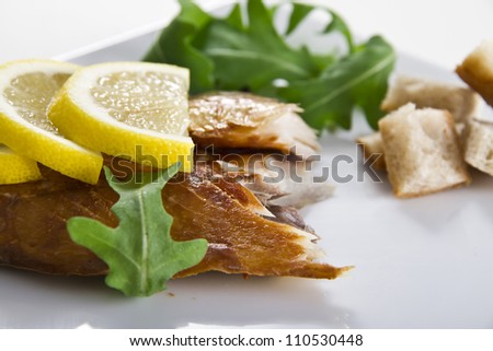 Smoked mackerel fish with lemon salad and bread