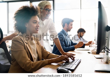 Group of business people working together, brainstorming in office